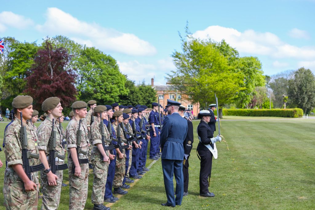 A senior-ranking military officer inspecting the school's Combined Cadet Force during the VE Day celebration at Langley Senior School.