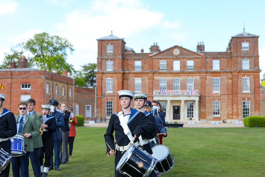 A senior-ranking military officer inspecting the school's Combined Cadet Force during the VE Day celebration at Langley Senior School.