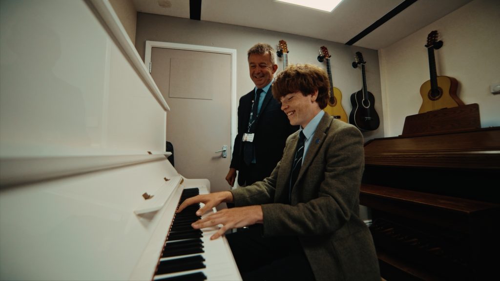music teacher at langley with pupil